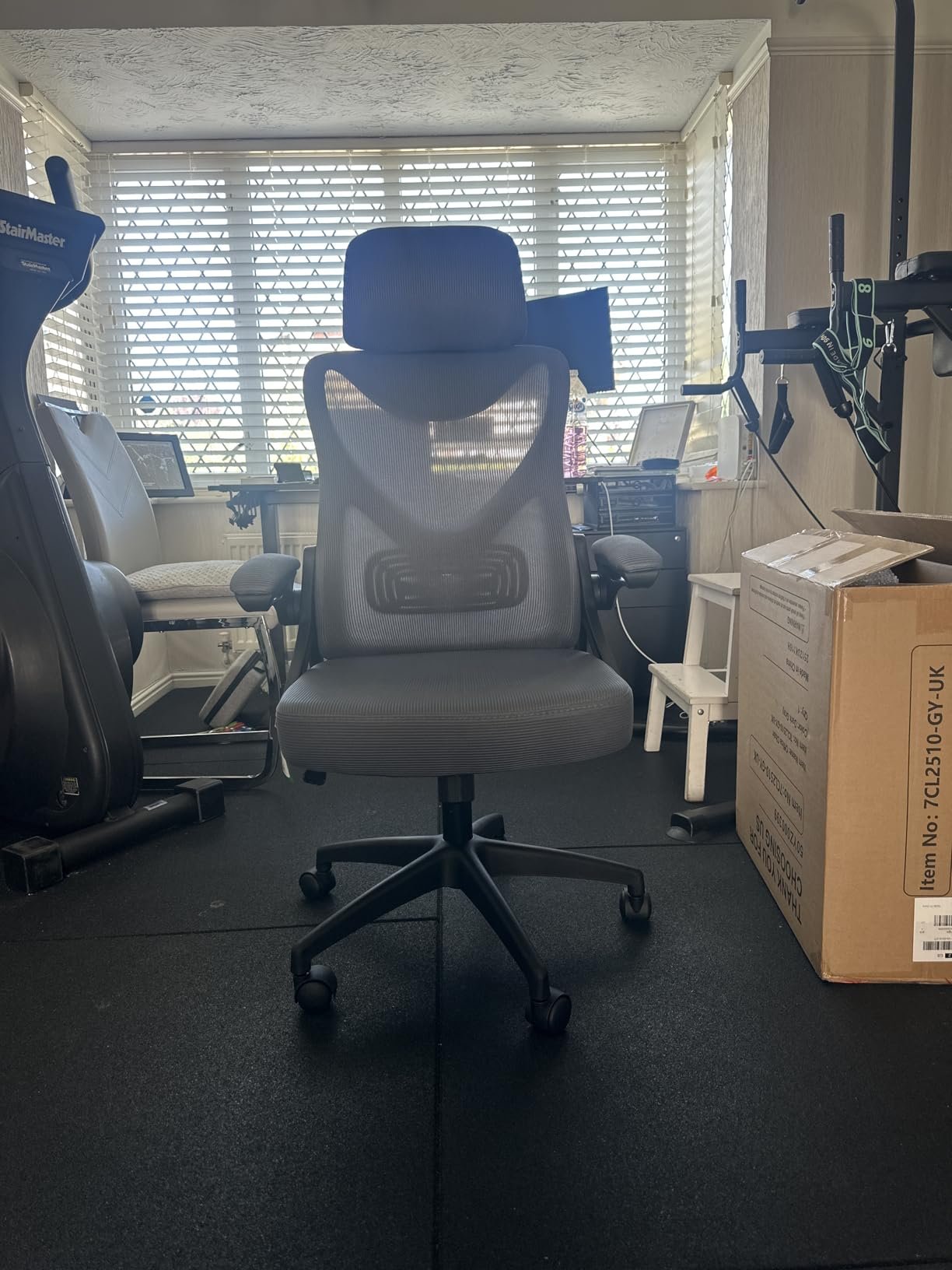 Customer rear-view photo showing the chair's back support