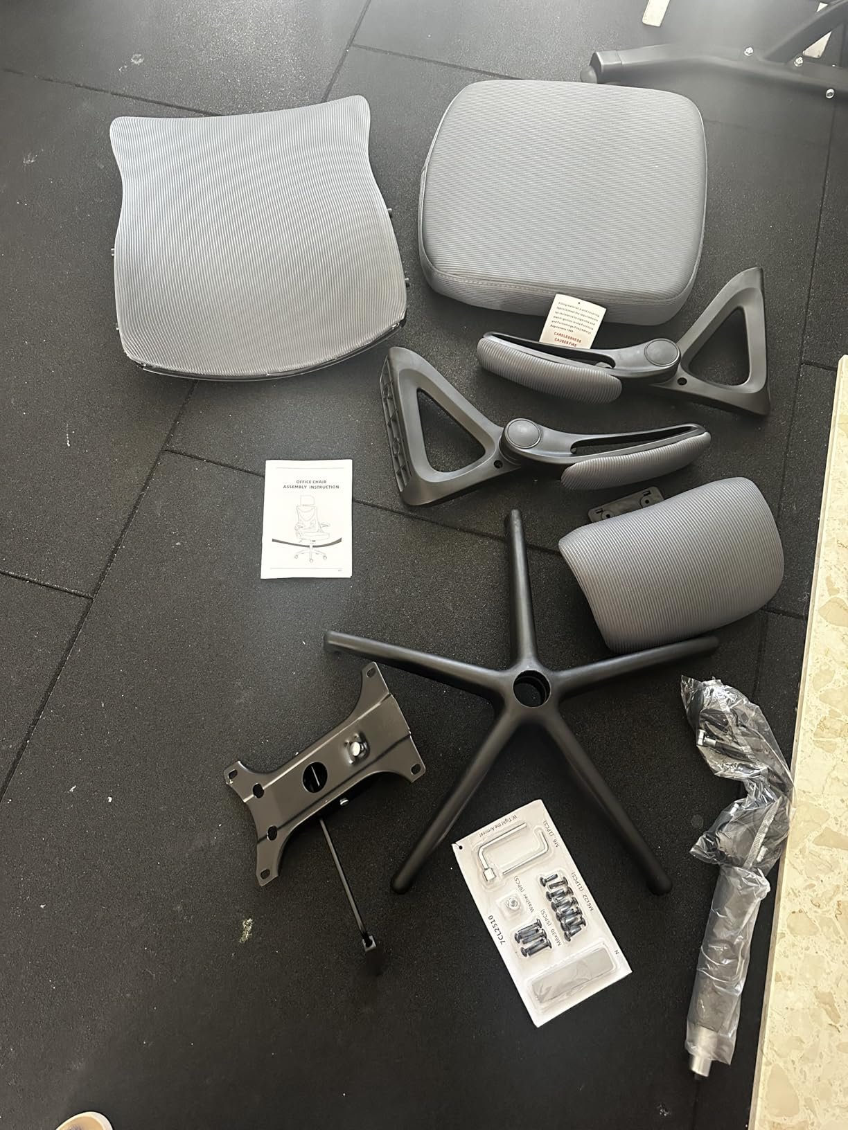 Customer photo of the chair parts before assembly